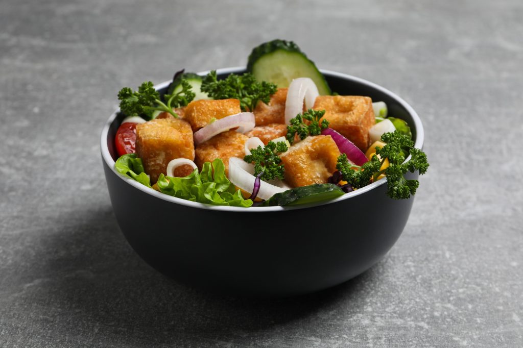 Fried tofu salad in a bowl close-up